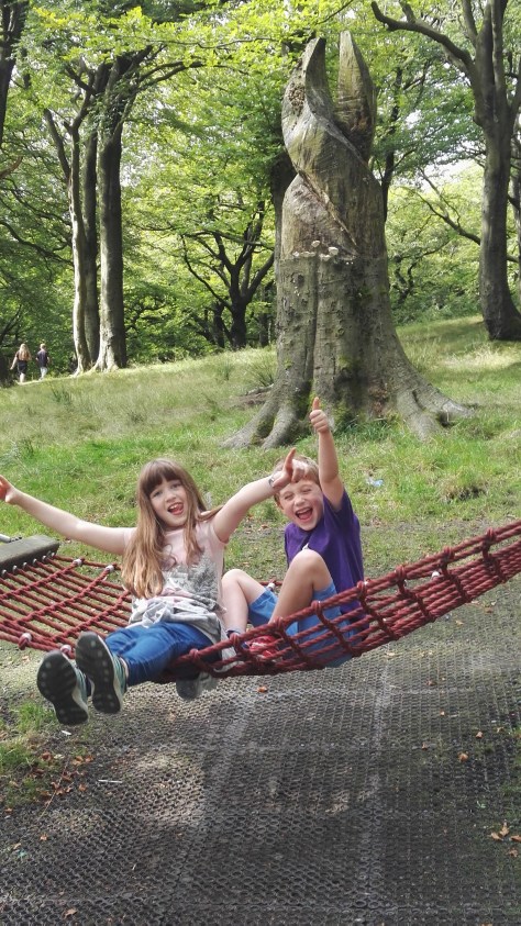 Our duo swinging at the park